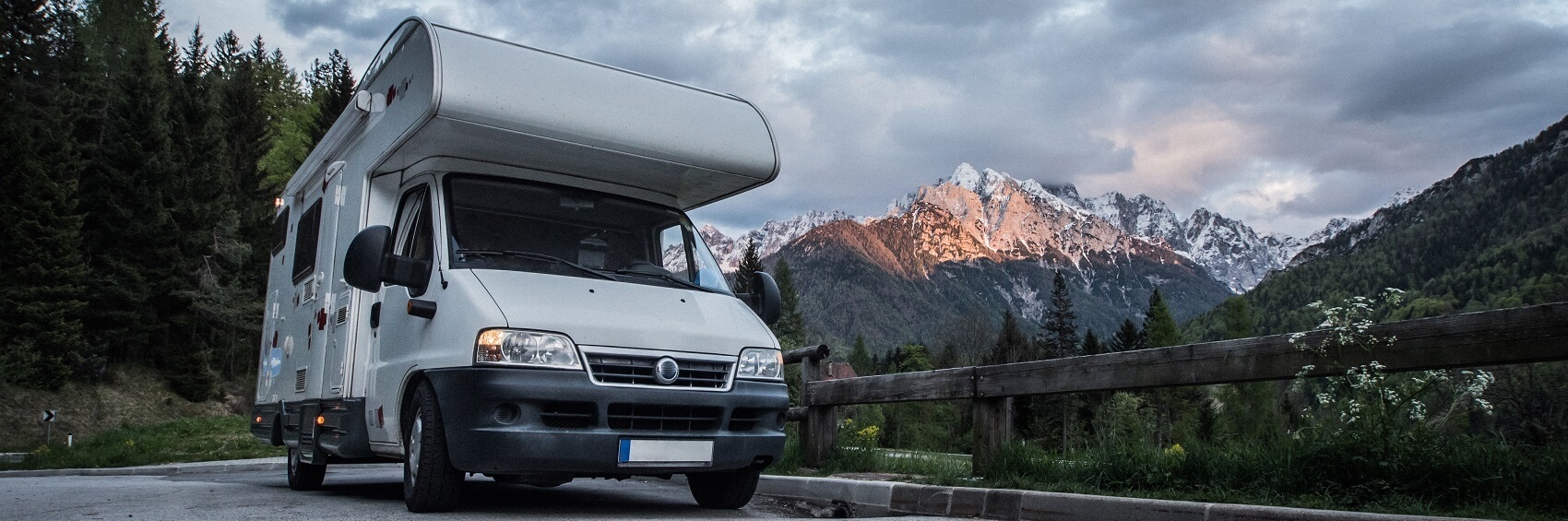 RV Driving near woods